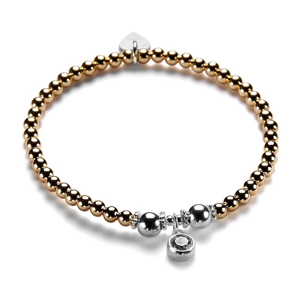 A rose gold and silver bracelet with a cubic zirconia sparkly charm pictured on a white background.