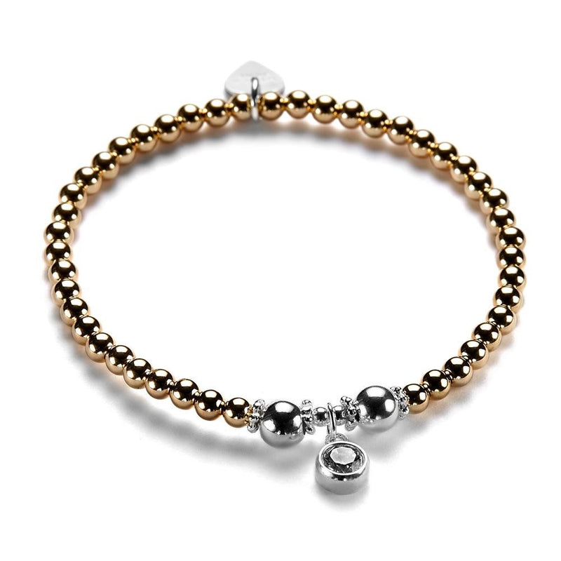 A rose gold and silver bracelet with a cubic zirconia sparkly charm pictured on a white background.