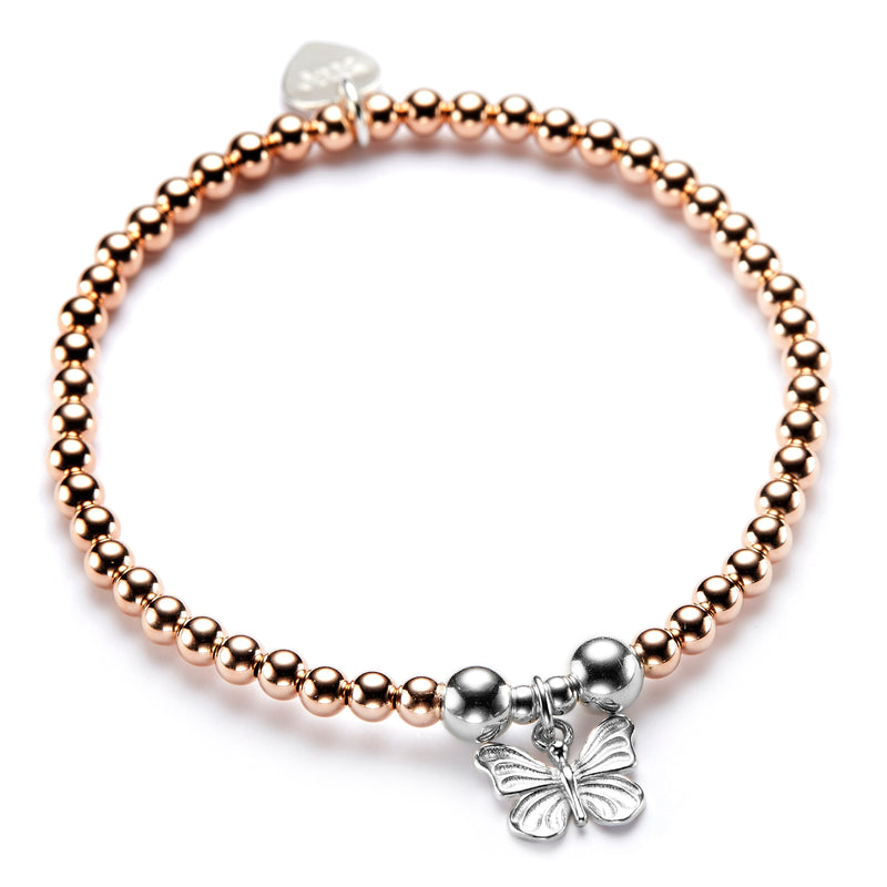 A rose gold beaded bracelet with a silver butterfly charm.