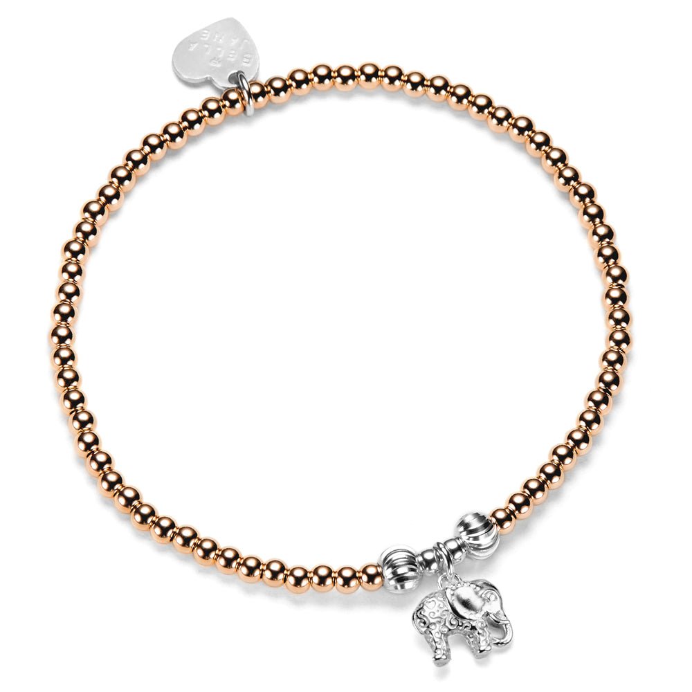 Bracelet with rose gold beads and silver elephant charm on a white background