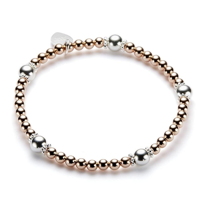 Bracelet with rose gold and silver beads on a white background