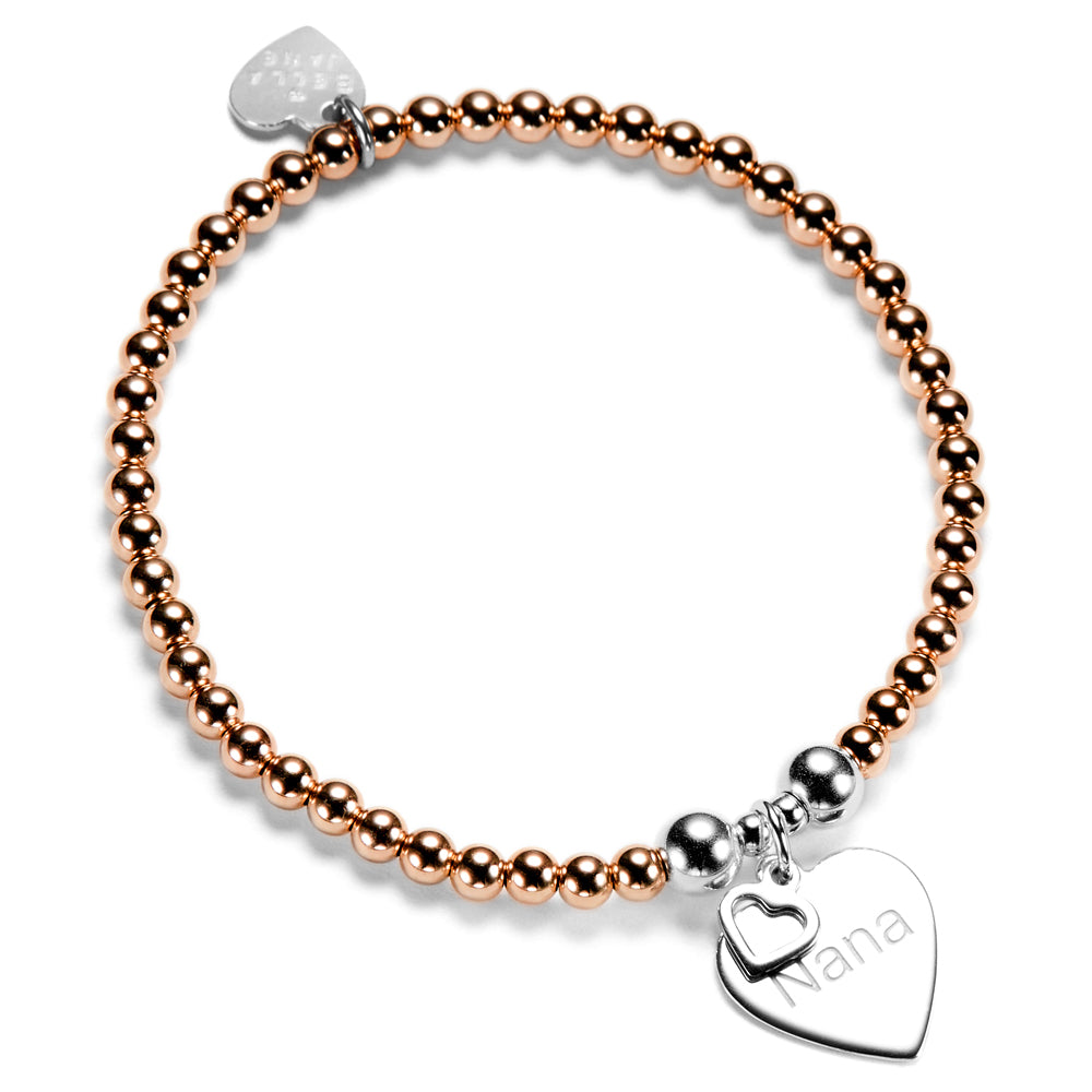 Rose gold beaded bracelet with silver heart-shaped charm featuring the word 'Nana' on a white background