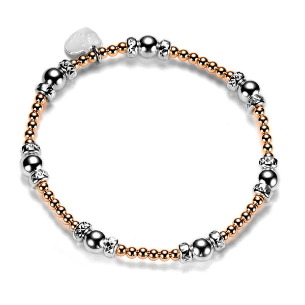 Bracelet with silver and rose gold beads on a white background