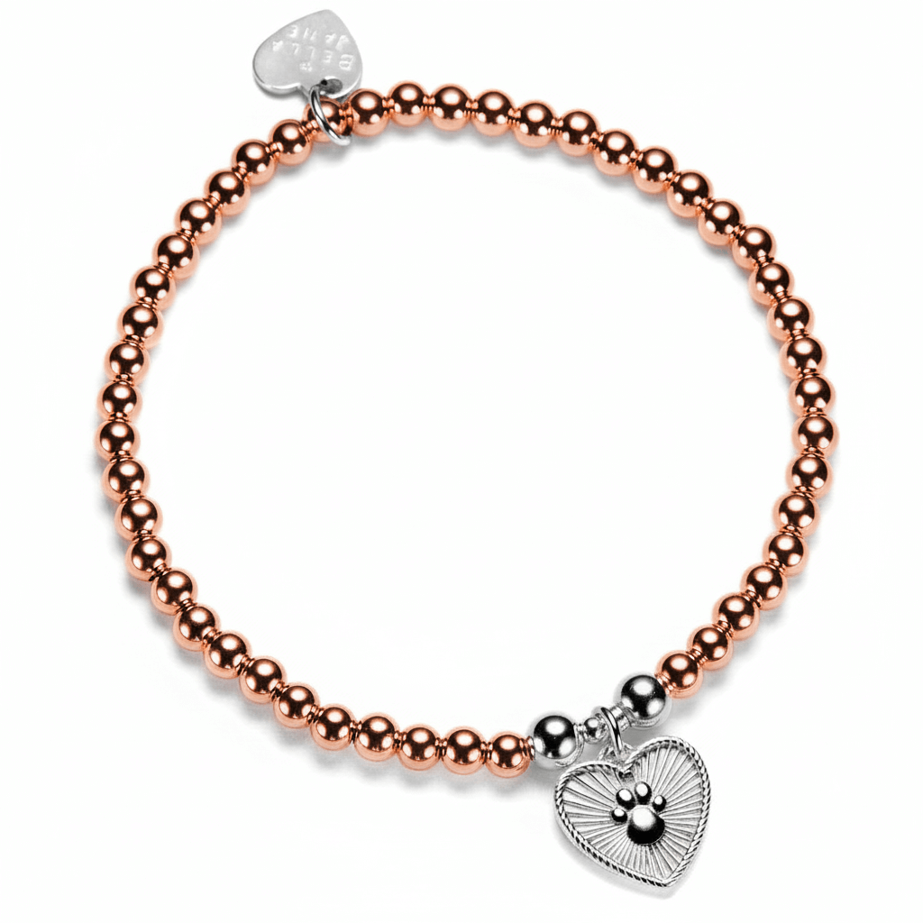 A rose-gold stacking bracelet with a beaded design featuring a heart-shaped charm with a paw print design, displayed on a white background.