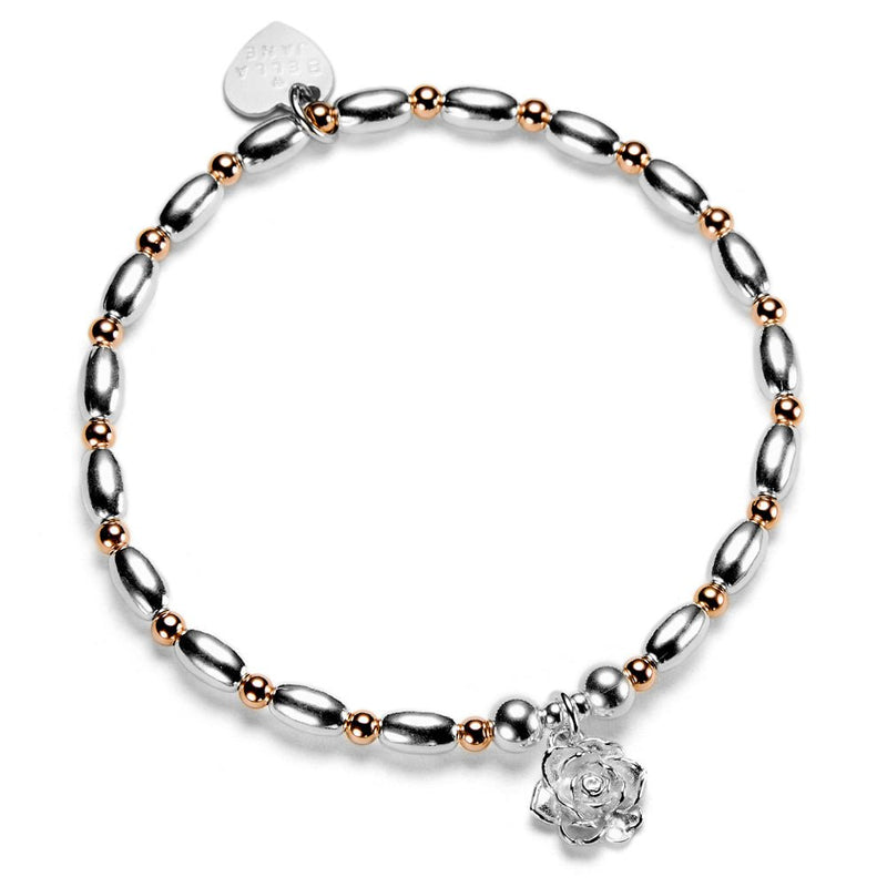 Silver and rose gold mixed metal beaded bracelet with a sterling silver flower charm, on a white background