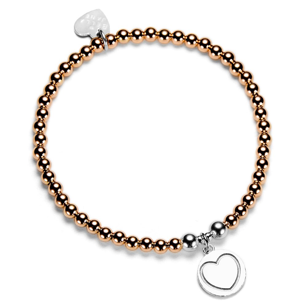 Rose gold beaded bracelet with silver heart charm on a white background