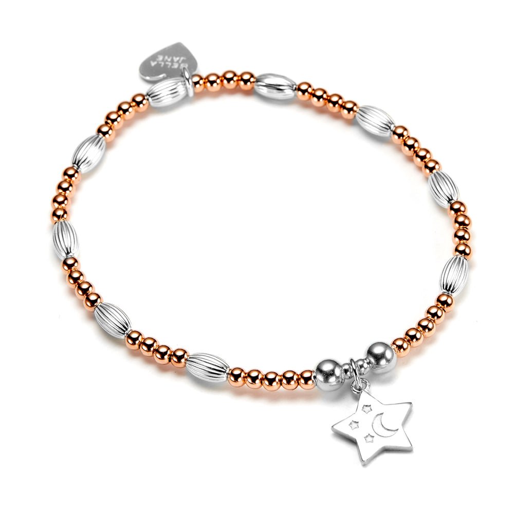 Bracelet with rose gold and silver beads and a star charm on a white background