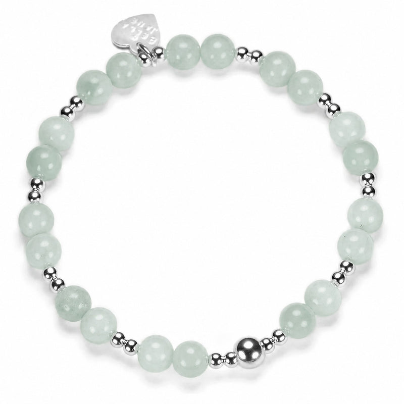 Bracelet with light green beads and silver accent beads on a white background