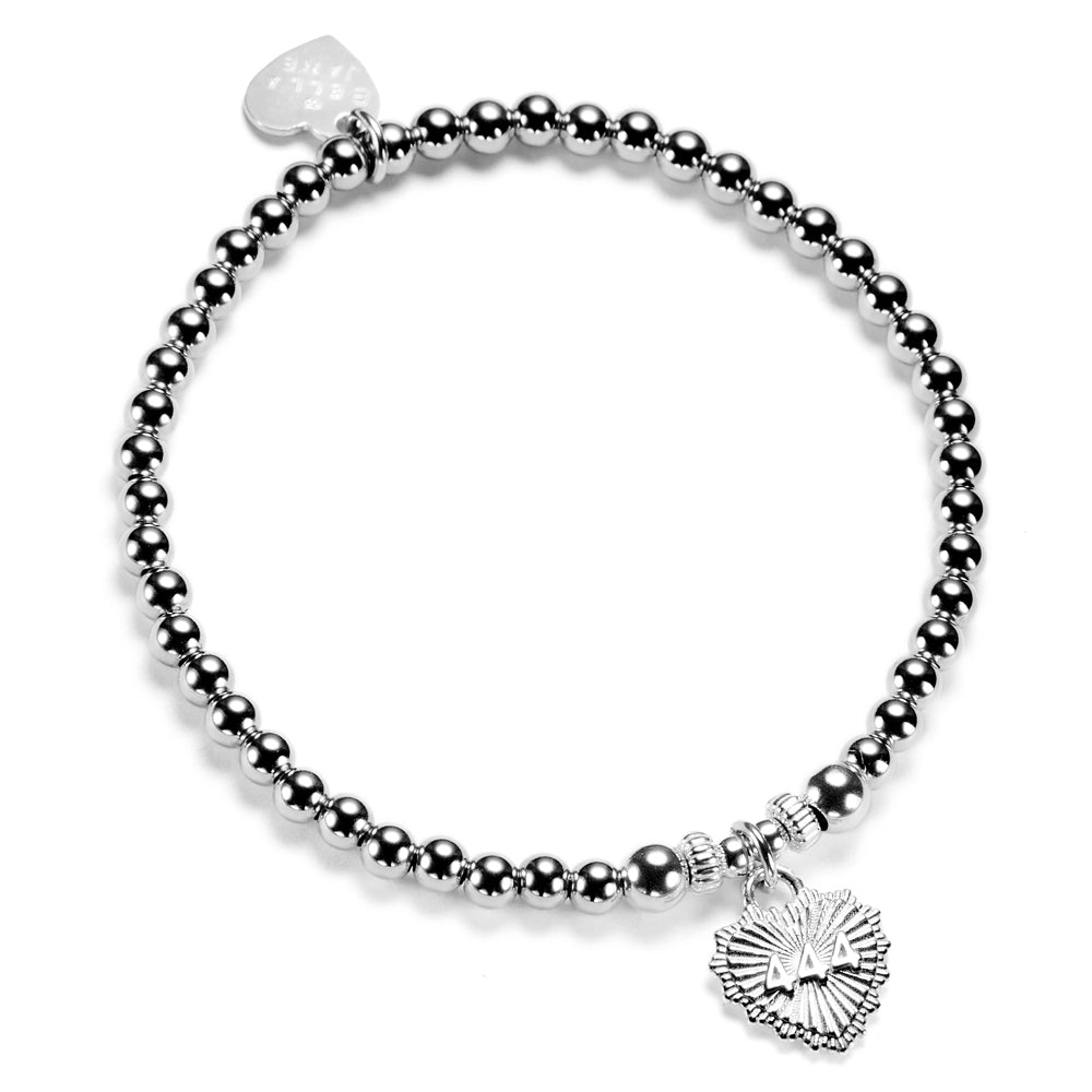 Silver beaded bracelet with heart-shaped charm featuring angel number 444 on the front of the charm, on a white background.