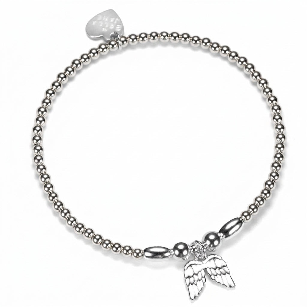 A sterling silver beaded stacking bracelet featuring a sterling silver angel wings charm, displayed on a white background.