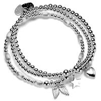A set of three sterling silver bracelets stacked together, featuring heart, angel wings, and star charms.