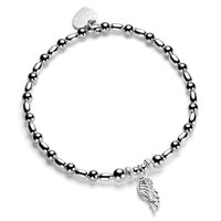 A sterling silver bracelet featuring a small oval bead pattern mixed with a sterling silver angel wing charm and a sterling silver Bella Jane heart tag.