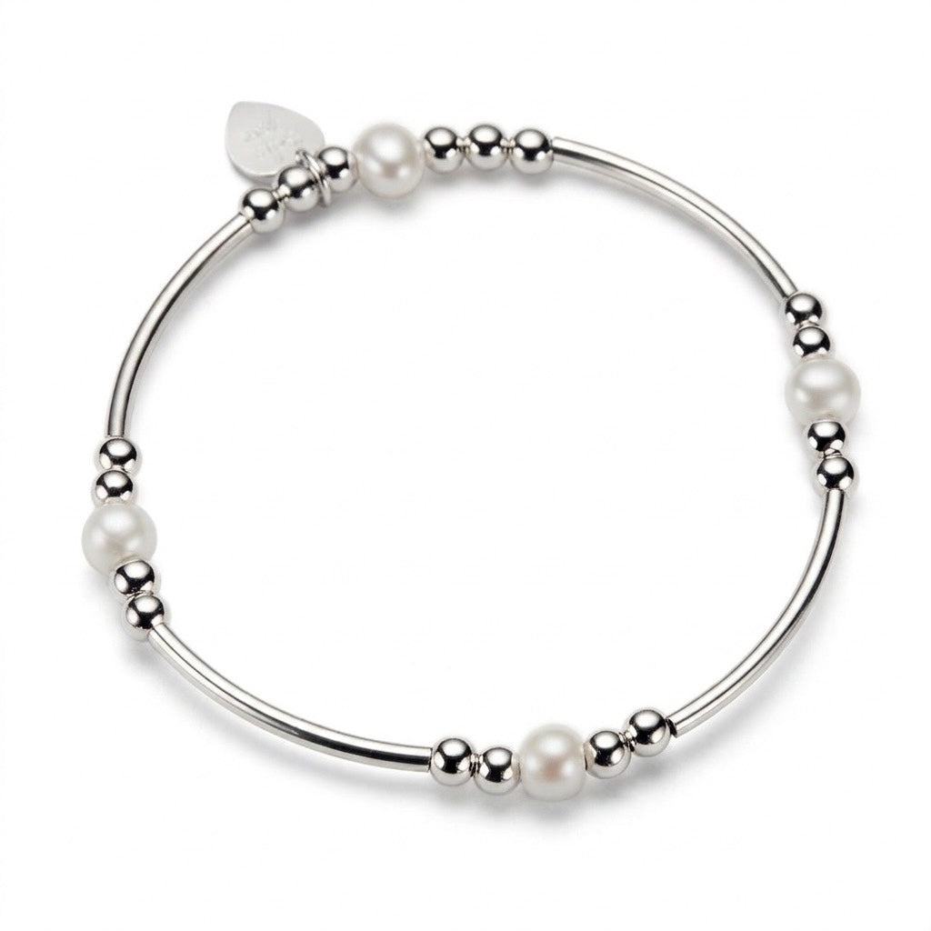 A silver beaded bracelet with cream freshwater pearl beads, shown on a clean white background.