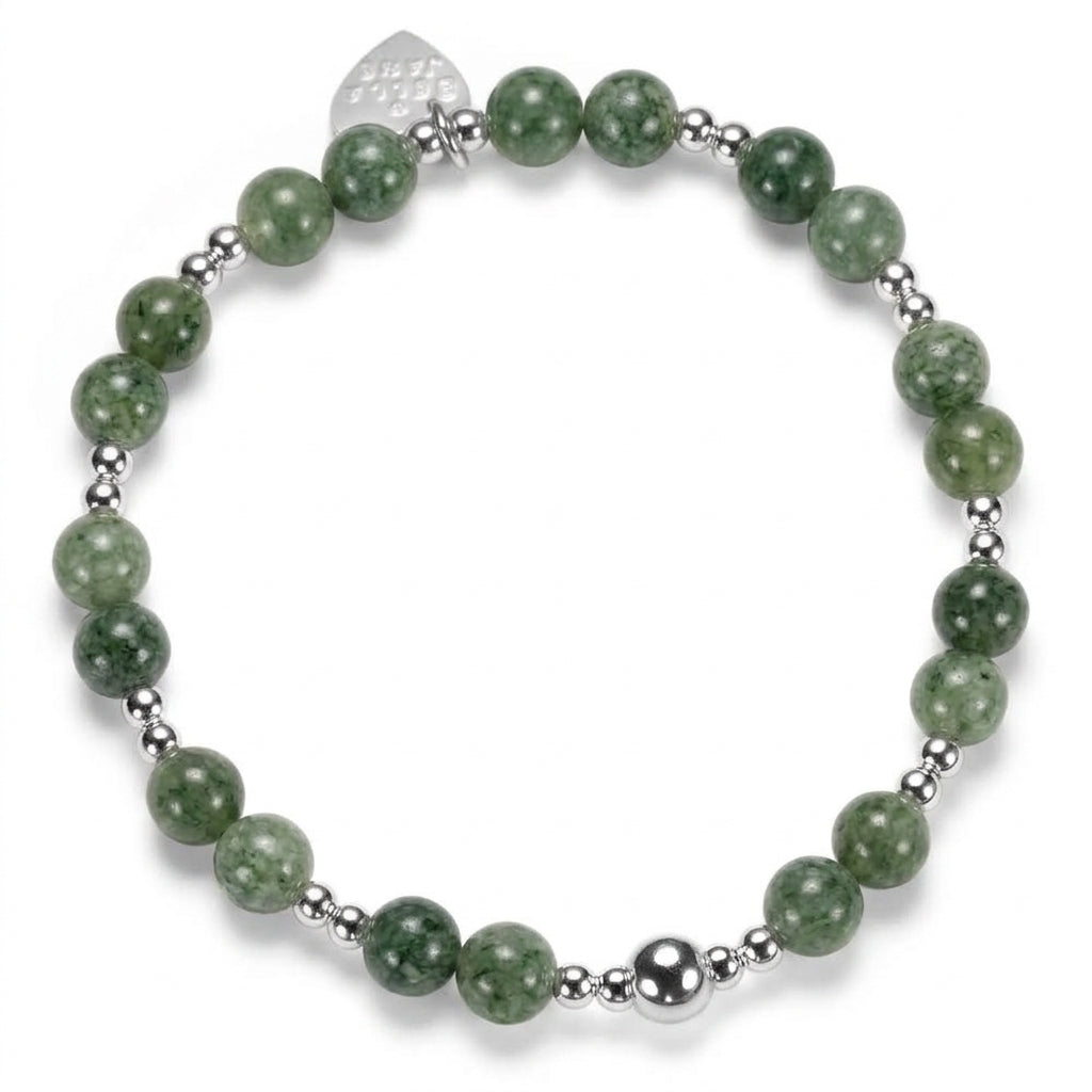 A beaded bracelet featuring round green stone beads and polished sterling silver beads, with a small silver heart tag engraved with Bella Jane, against a white background.