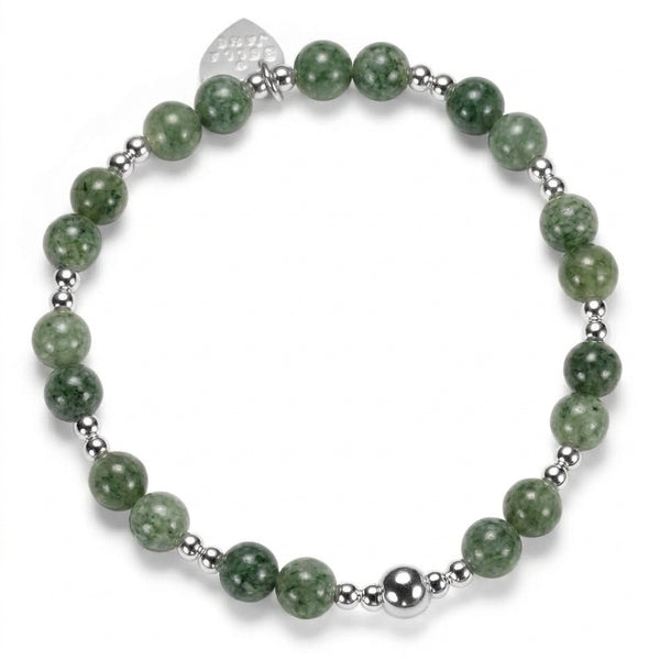 A beaded bracelet featuring round green stone beads and polished sterling silver beads, with a small silver heart tag engraved with Bella Jane, against a white background.