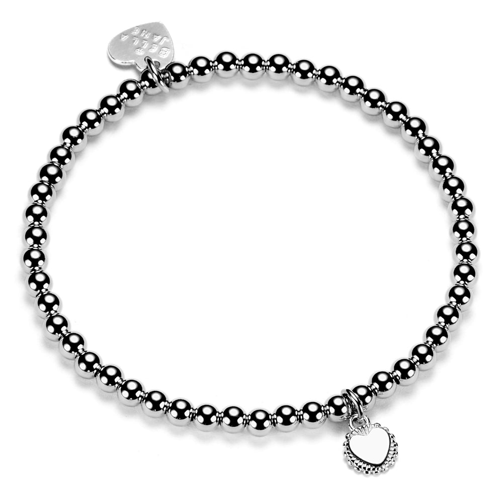 A sterling silver ball bead bracelet with a single engraved disc charm displaying a initial, presented on a white background.