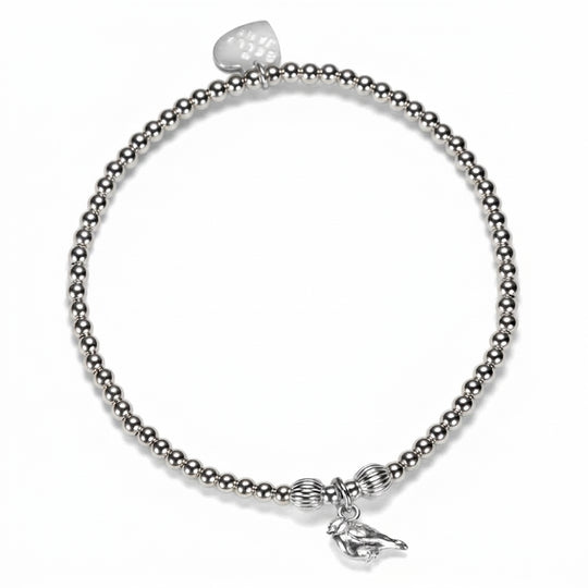 A silver beaded stretch bracelet featuring a small robin charm, displayed on a clean white background.