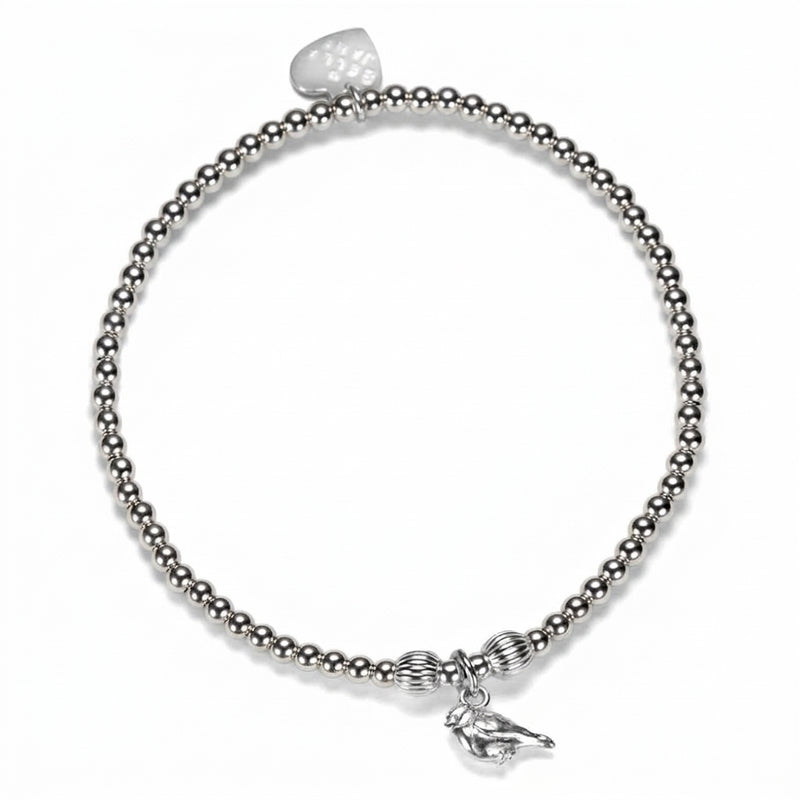 A silver beaded stretch bracelet featuring a small robin charm, displayed on a clean white background.