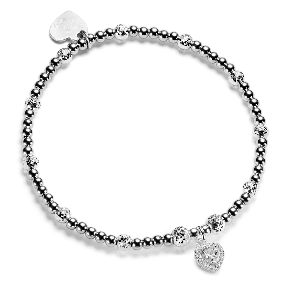 Silver beaded bracelet with heart-shaped cubic zirconiacharm, on a white background