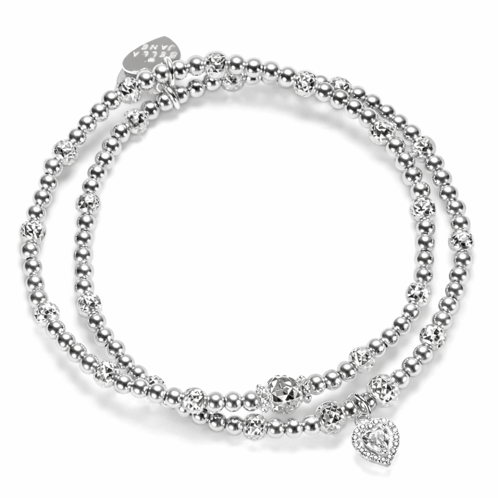 2 silver beaded Bella Jane stacking bracelets, featuring sparkly faceted beads with one bracelet featuring a sterling silver and cubic zirconia sparkly heart charm, against a white background.