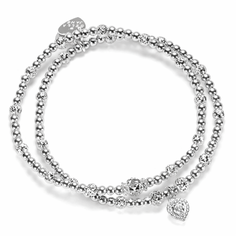 2 silver beaded Bella Jane stacking bracelets, featuring sparkly faceted beads with one bracelet featuring a sterling silver and cubic zirconia sparkly heart charm, against a white background.