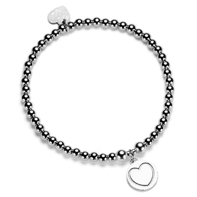 A silver beaded bracelet with sterling disc charm with a heart shape on a white background