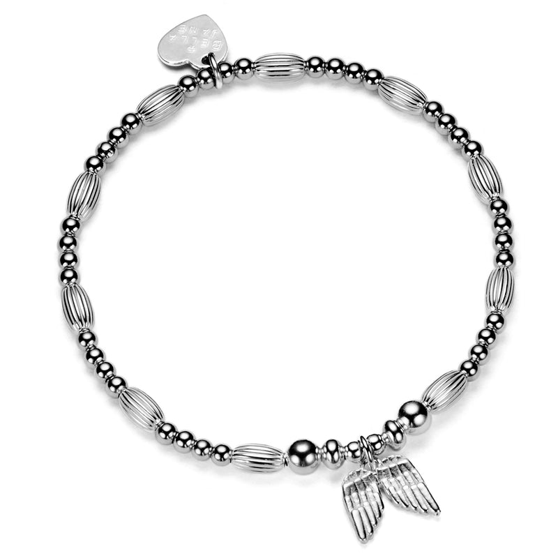 A  silver beaded bracelet featuring a double wing silver charm on a white background