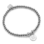 Sterling silver beaded stacking bracelet with be happy disc charm