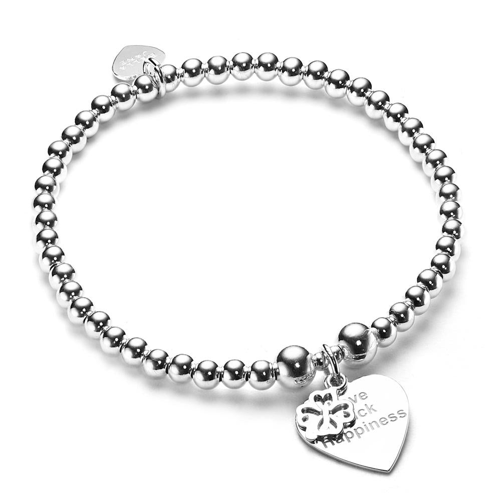 sterling silver beaded stacking bracelet with heart disc charm featuring the words Love, luck, happiness