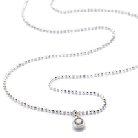 A sterling silver ball bead chain necklace with a cubic zirconia 'bling' charm.