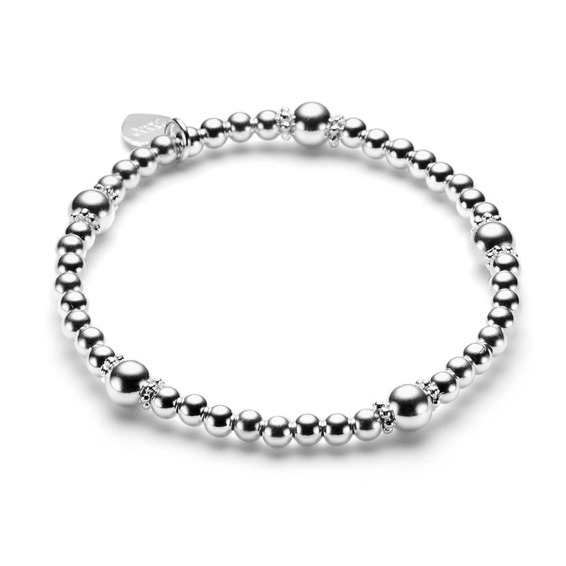 A sterling silver beaded bracelet featuring 4mm, 6mm and daisy spacer beads, displayed on a white background