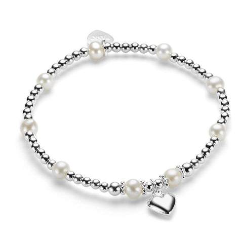 A sterling silver bracelet with freshwater pearls and a silver heart charm, displayed against a white background.