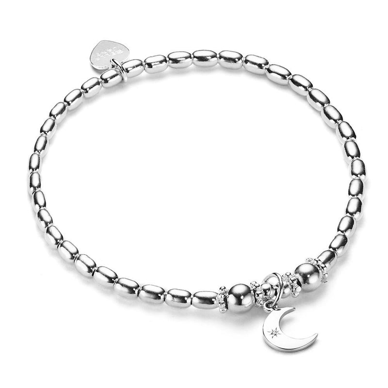 A sterling silver oval beaded bracelet with a moon charm with small cubic zirconia, displayed on a white background.