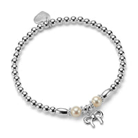 Silver beaded bracelet with a freshwater pearl either side of a small silver bow charm, on a white background