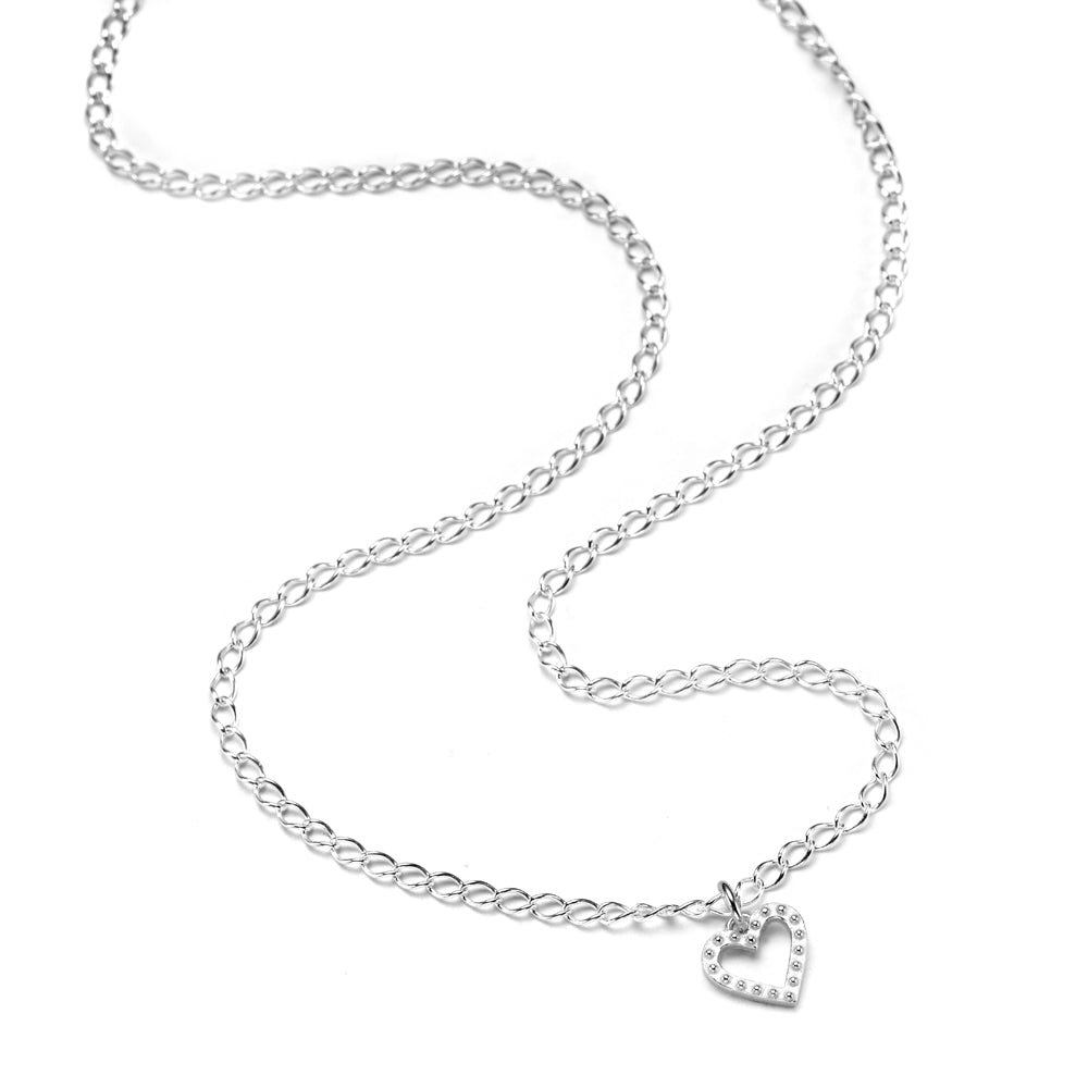 A sterling silver necklace with a delicate link chain, a studded heart charm, and a signature heart tag.
