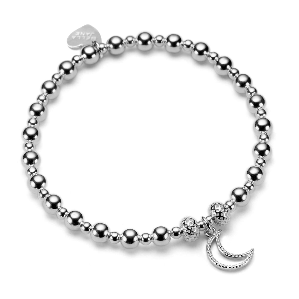 A sterling silver bracelet with  a moon charm, displayed on a white background.