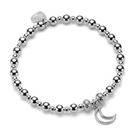 A sterling silver bracelet with  a moon charm, displayed on a white background.